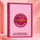 Mococulture Gorgeous 6-in-1 Palette notebook in a pink hardcover case, displayed on a pink pedestal against a pink background with a leaf silhouette.