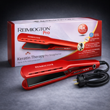 Red hair straightener with packaging on a dark background