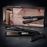 Remington hair iron with packaging on a dark background